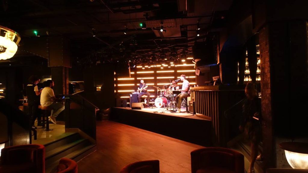 The stage at Stereo Covent Garden, with its L-Acoustics two clusters of six L-Acoustics A15 Wide and two L-Acoustics KS21 subwoofers on either side of the stage.