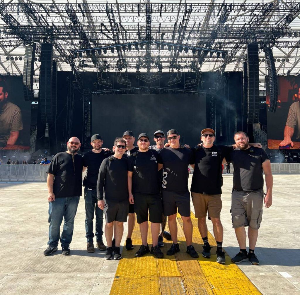 ODESZA and Clearwing’s audio production crew pictured with the tour’s large K1 system in the background at BMO Stadium in Los Angeles