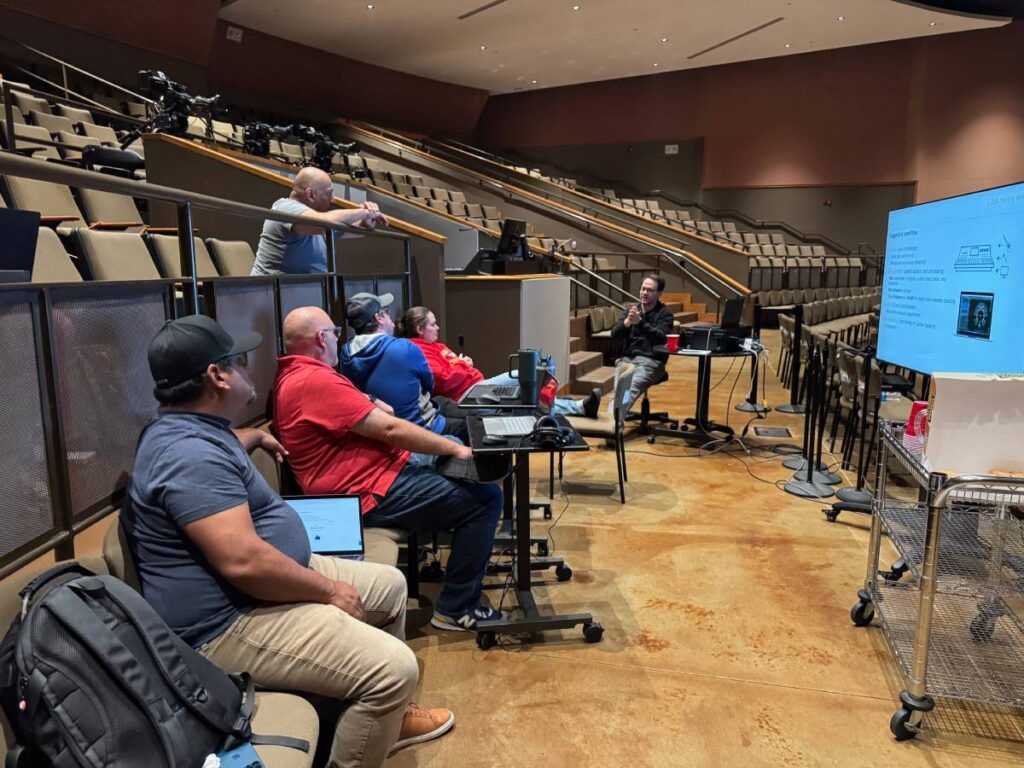 L-Acoustics Application Engineer James Rudder (right) conducting an L-ISA training for the church’s technical team